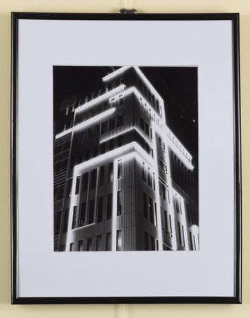 black & white photo of the building with lights up the side