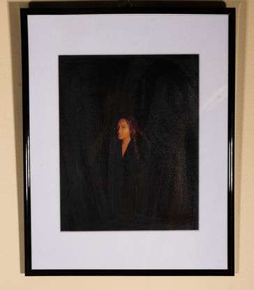 A black woman with a cold stare.