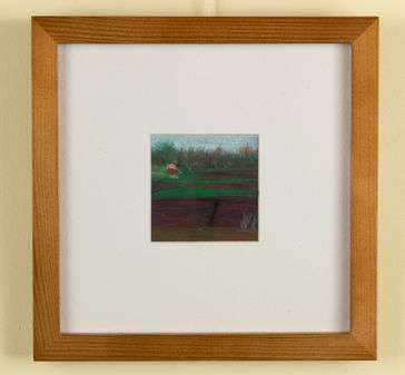 red cranberry bush with red house in the back