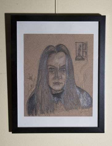 Portrait of a woman with multiple eyes staring at the viewer. 