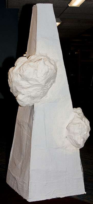 Tower with clouds. Baby blue for tower and the clouds are white.