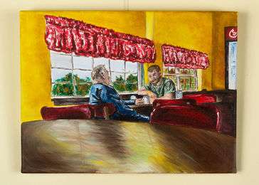 Grandfather and grandson share a moment on a sunny day at a local cafe